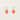 Heart-shaped earrings with pink and orange gradient on a light gray background