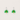 Pair of green leaf-shaped earrings on a light gray background