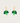 Green leaf-shaped earrings on gold hoops against a beige background