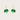 Green leaf-shaped earrings on gold hoops against a beige background