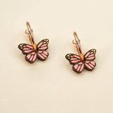 'Monarch Butterfly in Pink' hoop earrings featuring pink butterflies by Materia Rica.