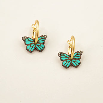 'Monarch Butterfly in Teal' hoop earrings featuring green butterflies by Materia Rica.