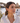 Model wearing Salvador Dalí tiger pattern acrylic hook earrings in Costa Brava setting